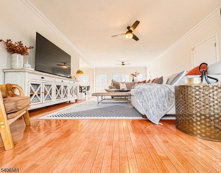 16 Gary Court Flanders, NJ 07836 - Photo 22 of 48 a spacious bedroom with a bed and a flat screen tv