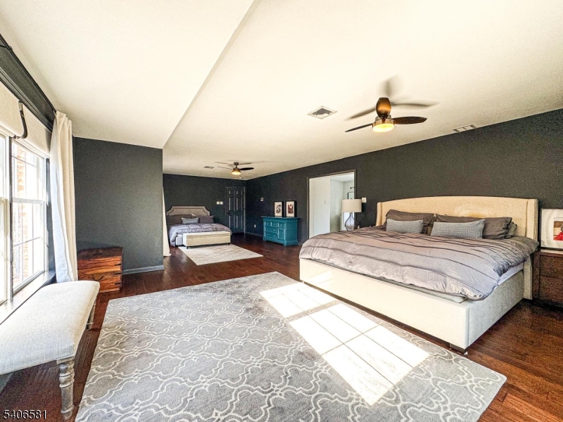 16 Gary Court Flanders, NJ 07836 - Photo 27 of 48 a bedroom with a large bed and wooden floor