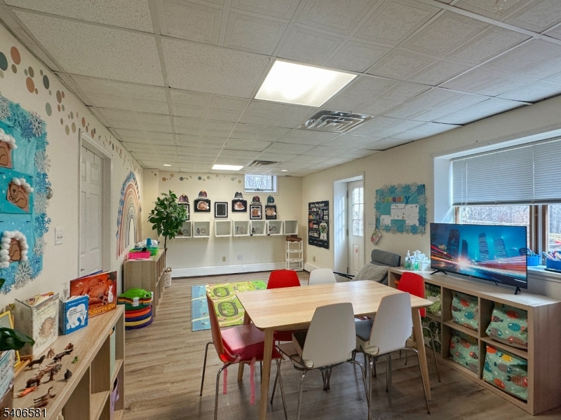 16 Gary Court Flanders, NJ 07836 - Photo 43 of 48 a dining room with a wooden floor and a dining table