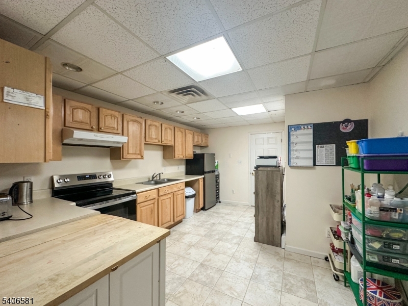 16 Gary Court Flanders, NJ 07836 - Photo 44 of 48 a kitchen with stainless steel appliances granite countertop a refrigerator and a stove top oven