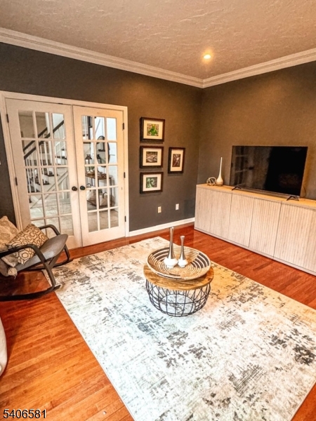 16 Gary Court Flanders, NJ 07836 - Photo 9 of 48 a living room with a couch and a flat screen tv
