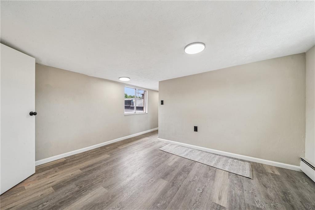 848 Pittsburgh Street Springdale, PA 15144 - Photo 15 of 25 a view of empty room with wooden floor