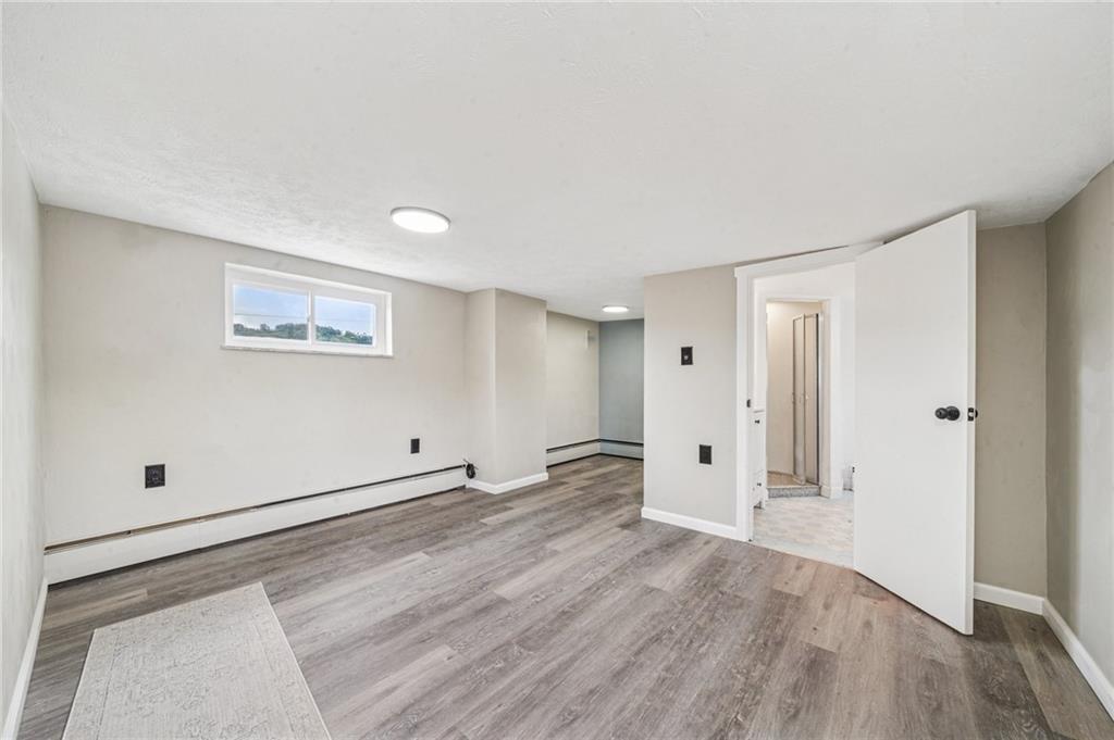 848 Pittsburgh Street Springdale, PA 15144 - Photo 16 of 25 a view of empty room with wooden floor