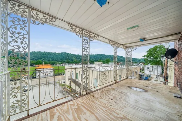 a view of balcony with furniture