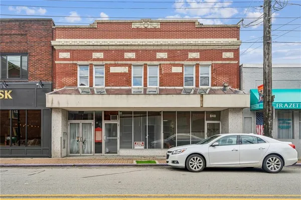 a car parked in front of a building