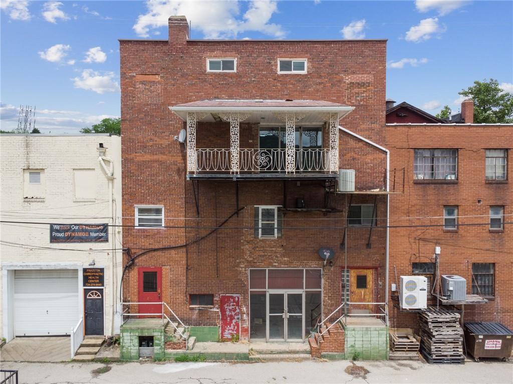 848 Pittsburgh Street Springdale, PA 15144 - Photo 24 of 25 a front view of a building with parking