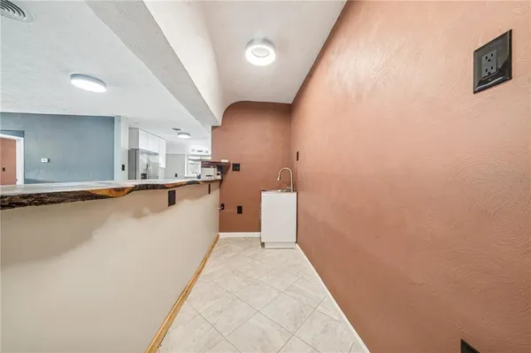 a view of a kitchen with wooden floor