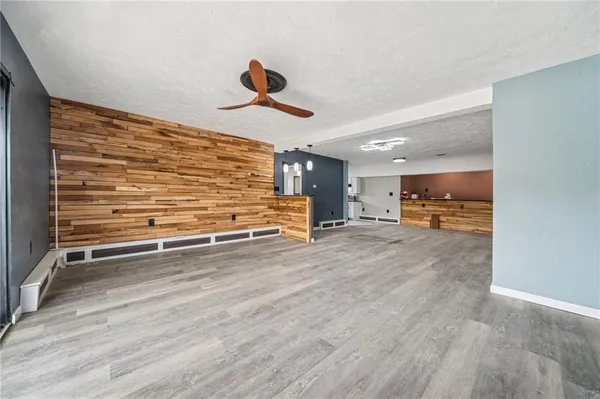 a view of room and wooden floor
