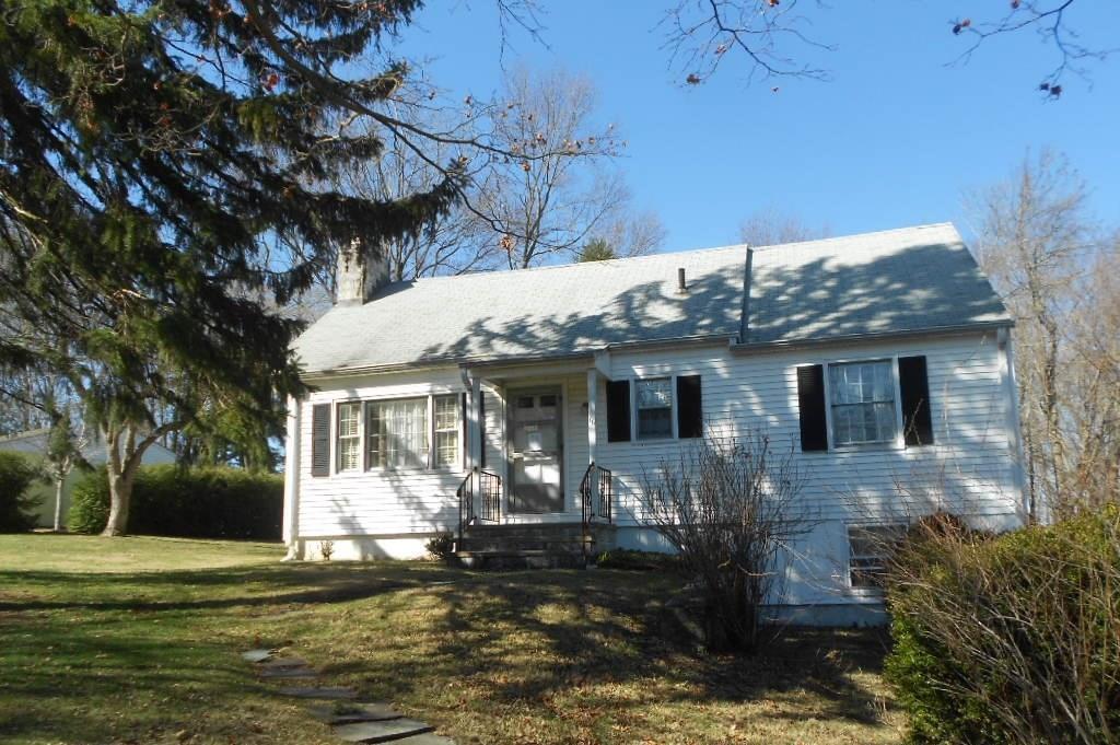16 Rowland Lane Ridgefield, CT 06877 - Photo 1 of 1 a front view of a house with a yard