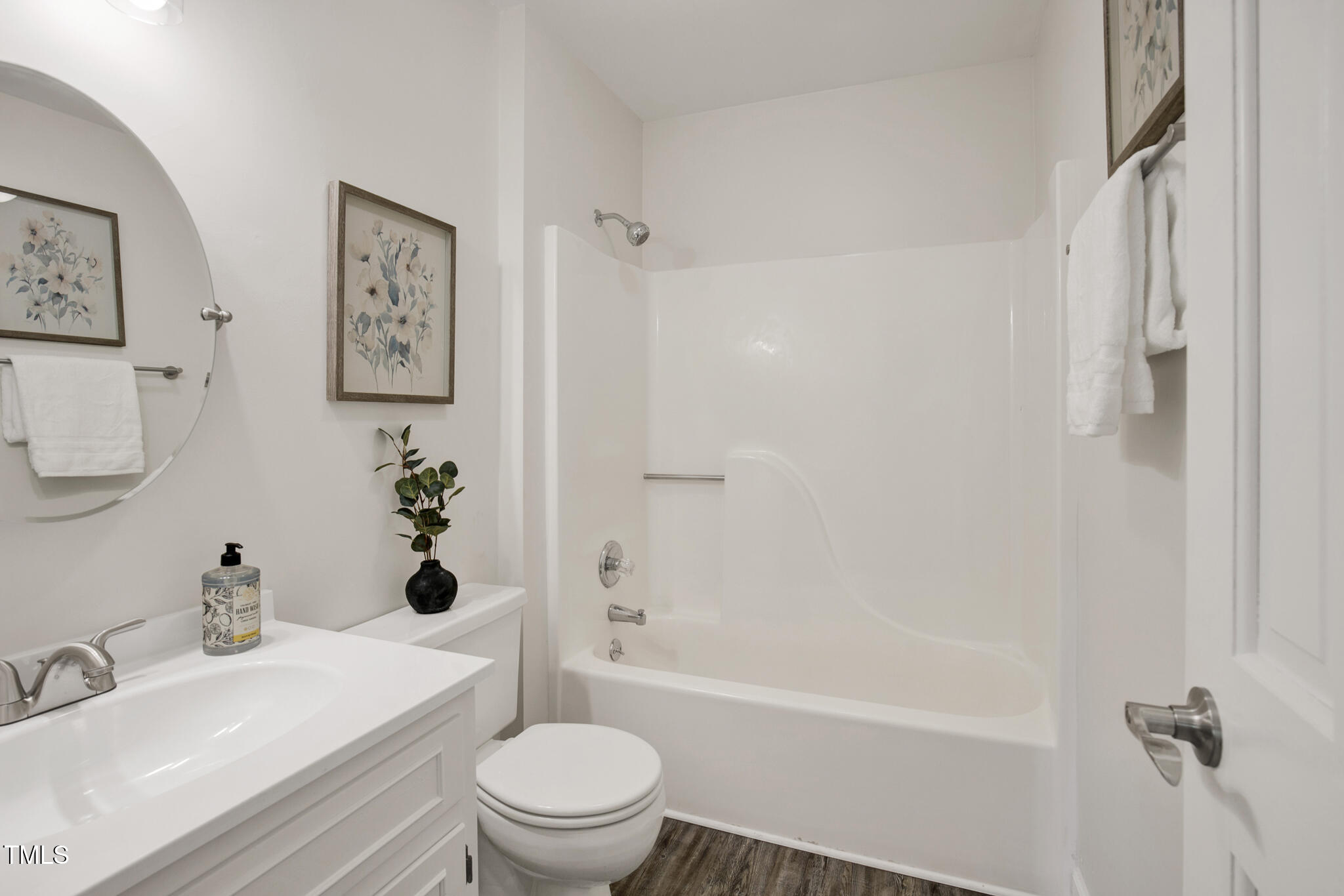 2611 Sawmill Road Raleigh, NC 27613 - Photo 17 of 31 a bathroom with a sink toilet and shower