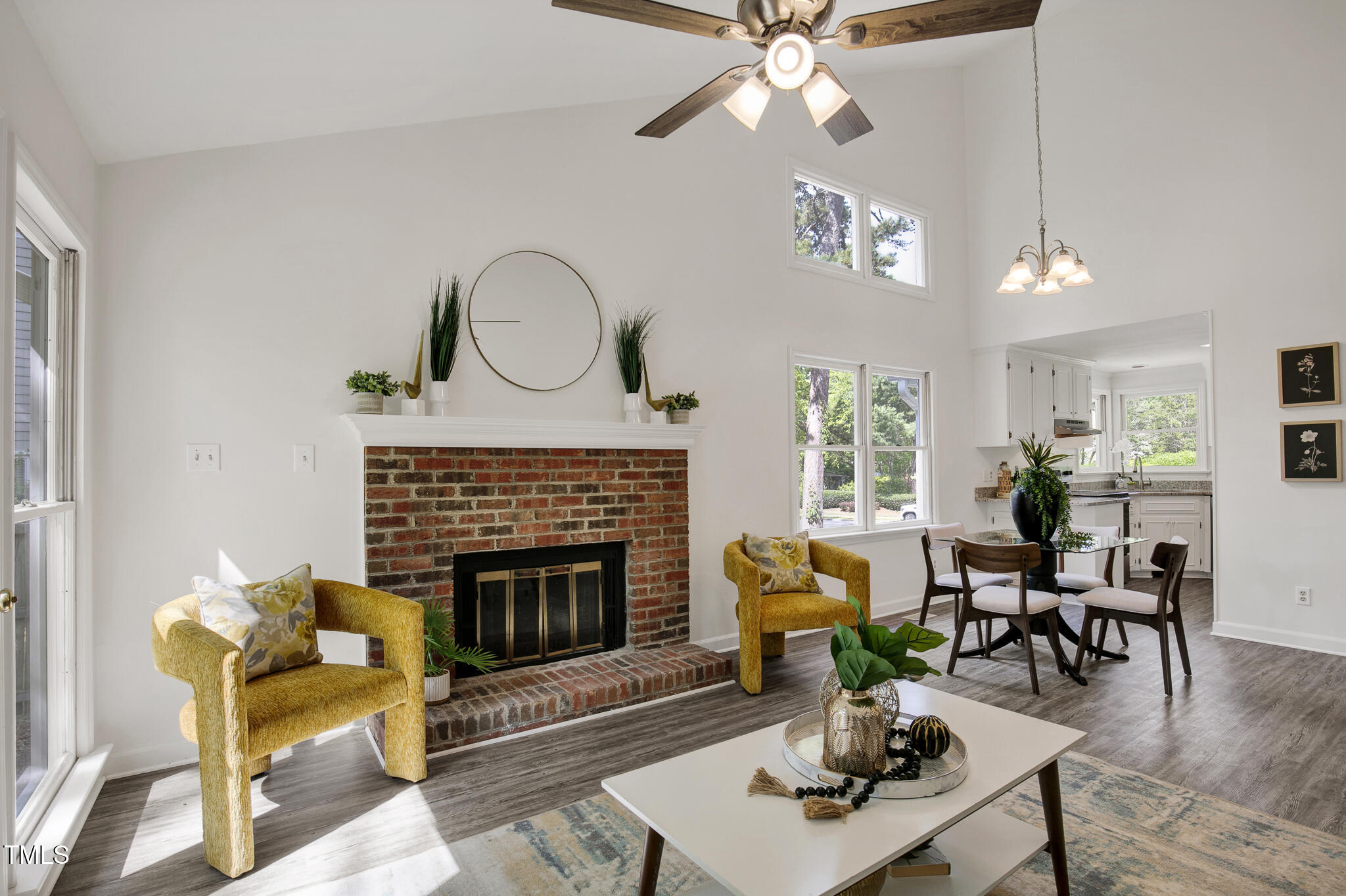 2611 Sawmill Road Raleigh, NC 27613 - Photo 7 of 31 a living room with furniture a fireplace and a flat screen tv