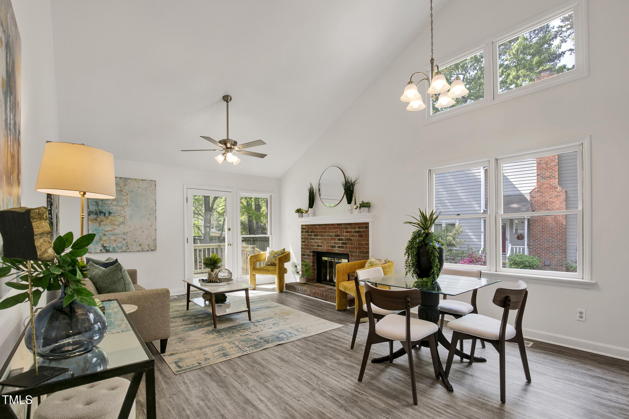 2611 Sawmill Road Raleigh, NC 27613 - Photo 8 of 31 a view of a dining room with furniture window and wooden floor