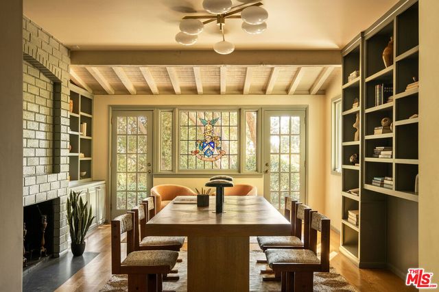 a view of a dining room with furniture and window