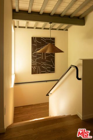 a bathroom with a mirror and a sink