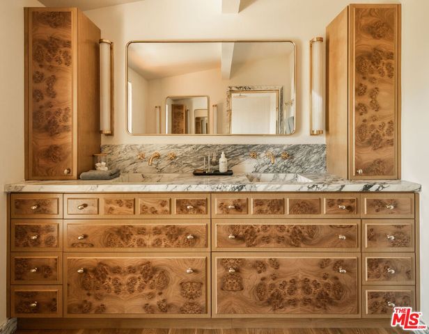 a bathroom with a tub and a shower