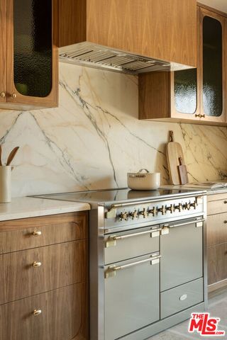 a close view of a stove and a microwave