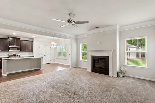 a view of a kitchen with microwave and stove top oven