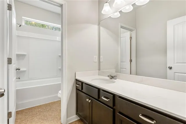a bathroom with a sink a vanity and a mirror