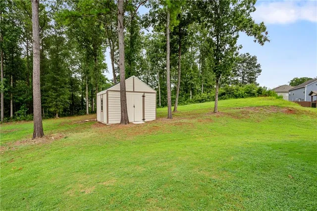 a backyard of a house with entertaining space and entertaining space