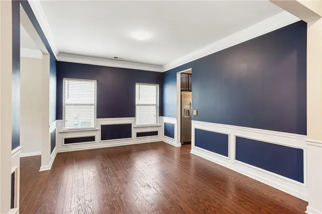 wooden floor in an empty room with a fireplace