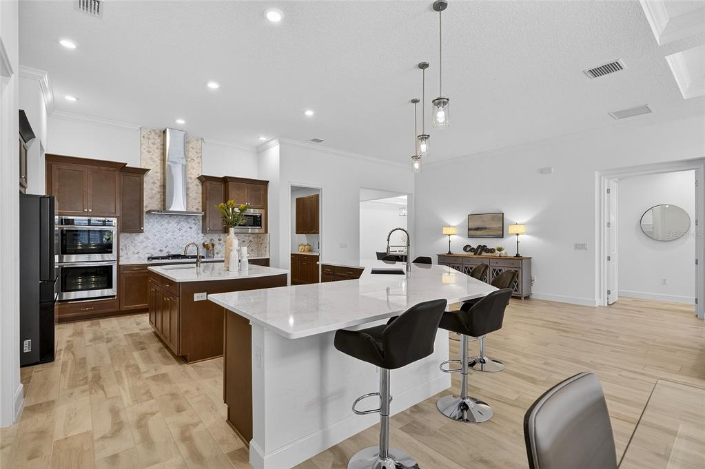 994 Signet Drive Apollo Beach, FL 33572 - Photo 21 of 98 a large kitchen with kitchen island a large island in it