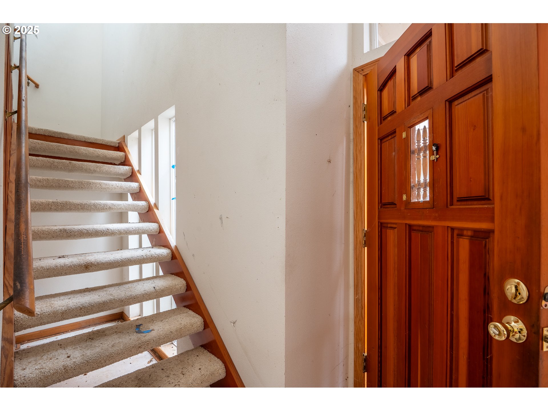3845 Wilshire Lane Eugene, OR 97405 - Photo 16 of 35 a view of staircase with white walls and a window