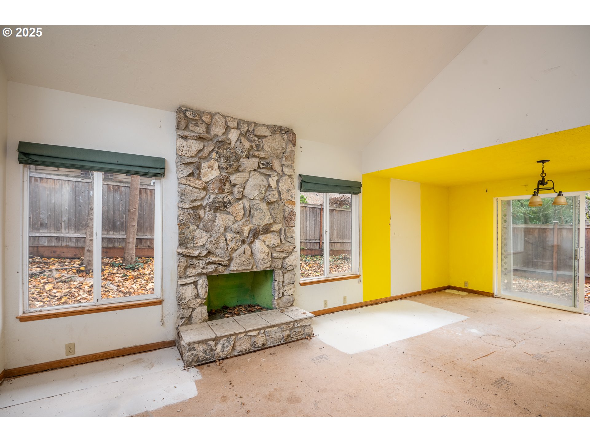 3845 Wilshire Lane Eugene, OR 97405 - Photo 17 of 35 a view of an empty room with a fireplace and a window