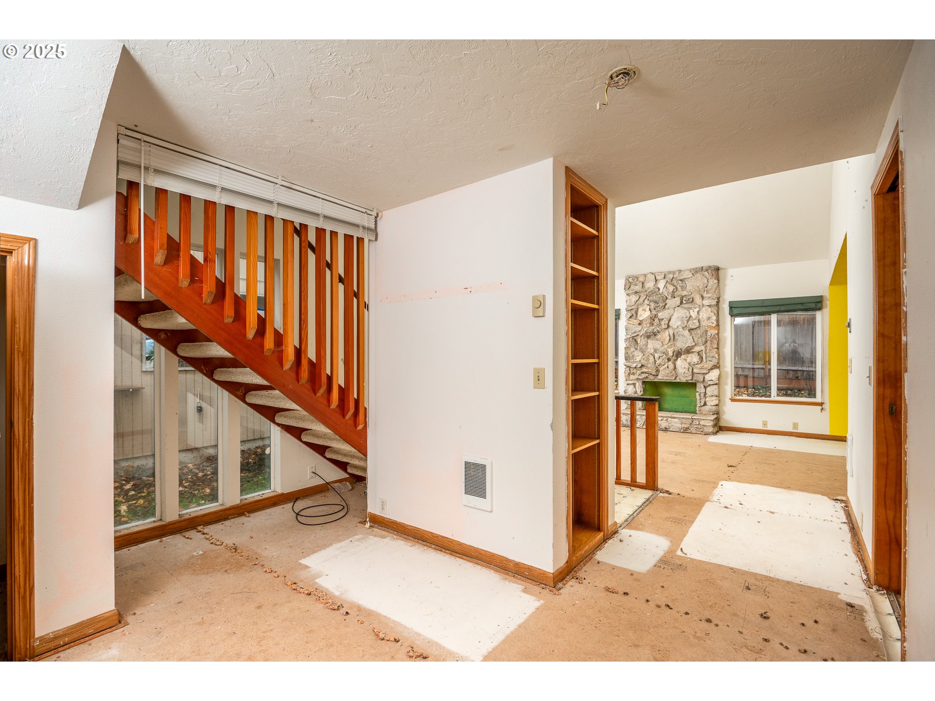 3845 Wilshire Lane Eugene, OR 97405 - Photo 26 of 35 a view of a livingroom with wooden floor and stairs