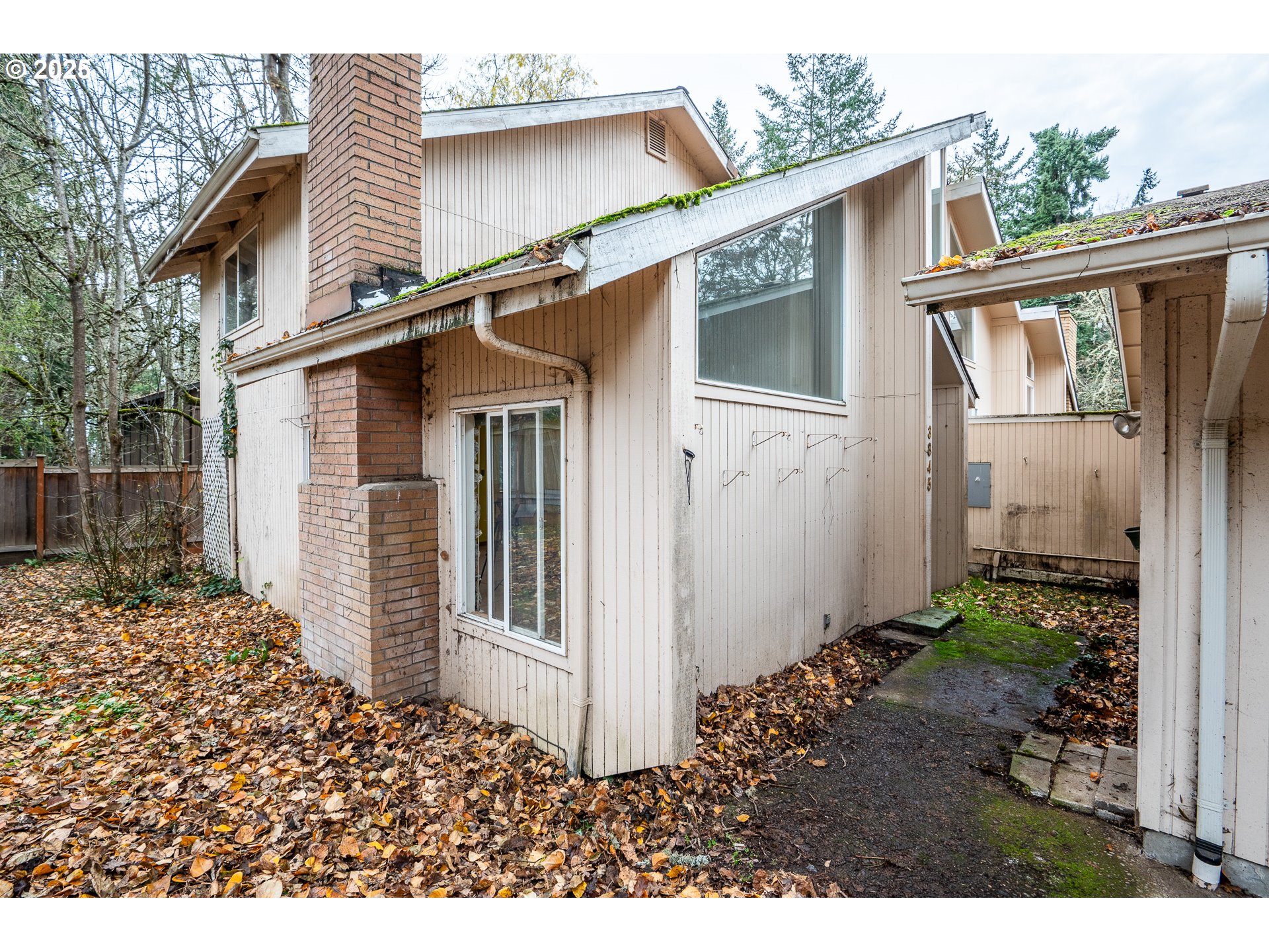 3845 Wilshire Lane Eugene, OR 97405 - Photo 35 of 35 a view of a house with a yard and wooden fence