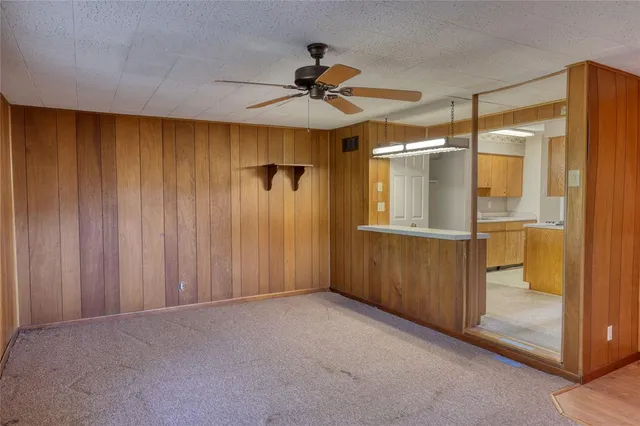 a view of a room with wooden walls