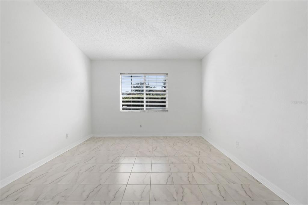 1504 Silktree Court Brandon, FL 33511 - Photo 14 of 26 an empty room with windows