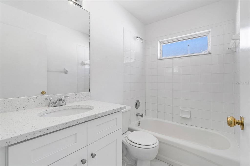 1504 Silktree Court Brandon, FL 33511 - Photo 19 of 26 a bathroom with a sink toilet and bathtub