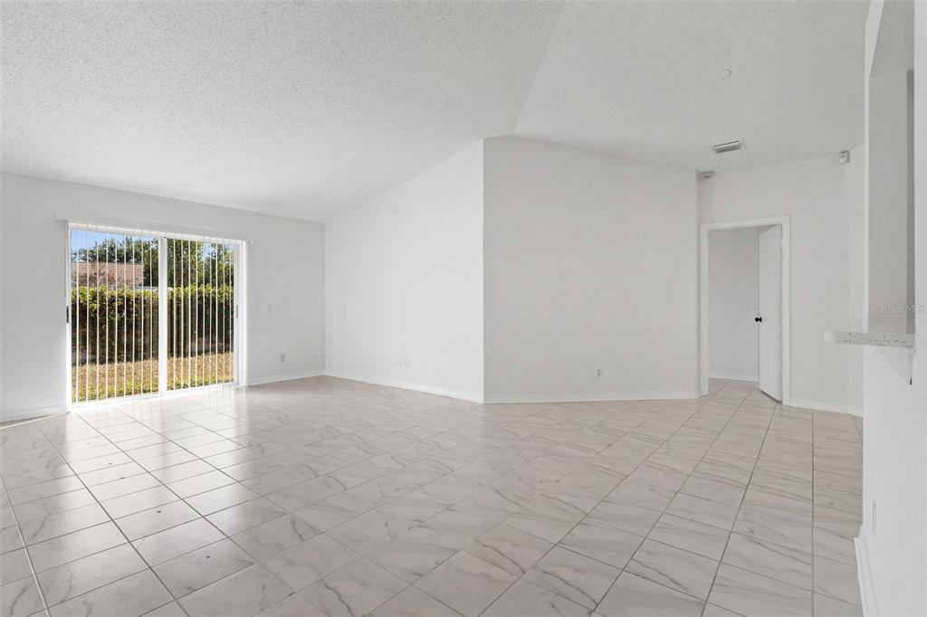 1504 Silktree Court Brandon, FL 33511 - Photo 5 of 26 a view of an empty room with glass door