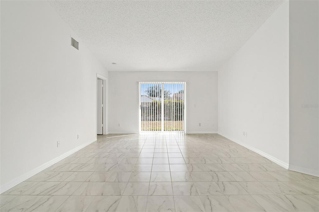 1504 Silktree Court Brandon, FL 33511 - Photo 7 of 26 a view of an empty room with a window