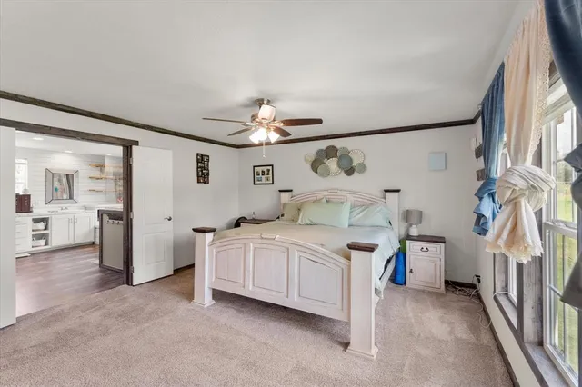 a bed room with a bed and a chandelier