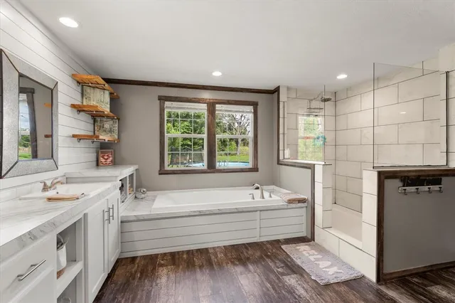 a bathroom with a bathtub sink and toilet