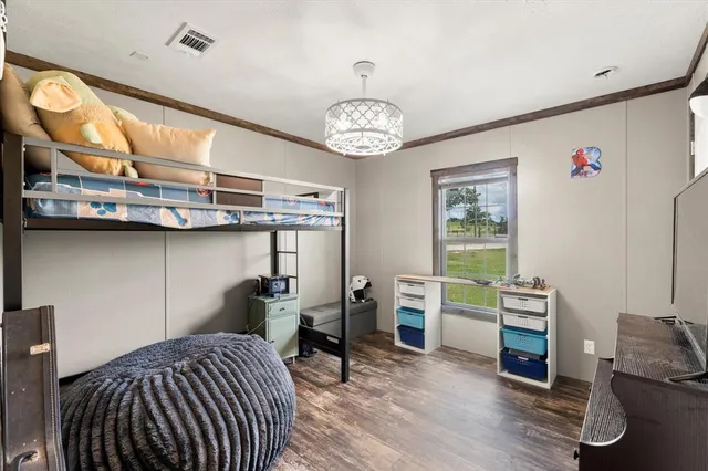 a view of a livingroom with furniture workspace and a window