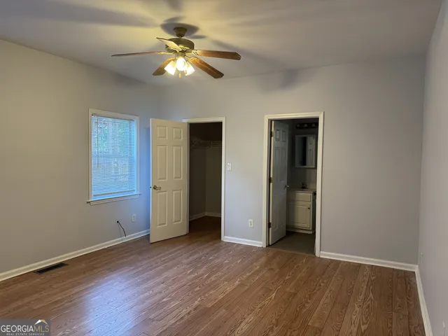 a view of a livingroom with a chandelier fan