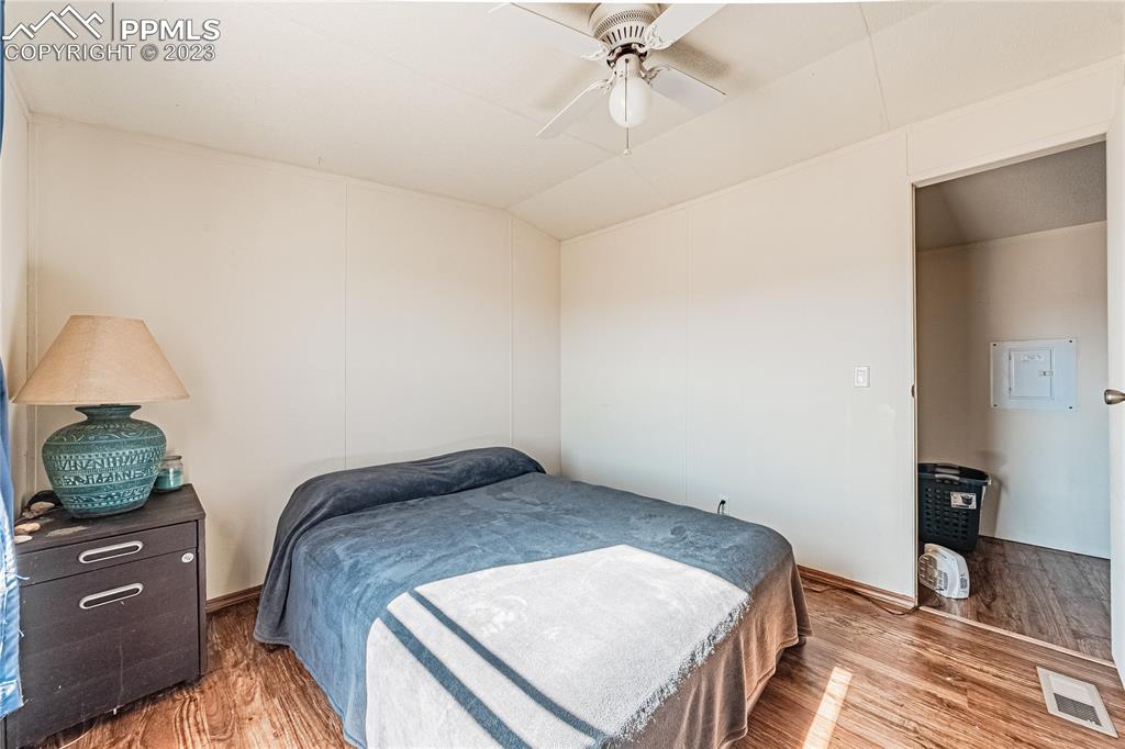 24225 East View Road Trinidad, CO 81082 - Photo 15 of 50 a bedroom with a bed and wooden floor