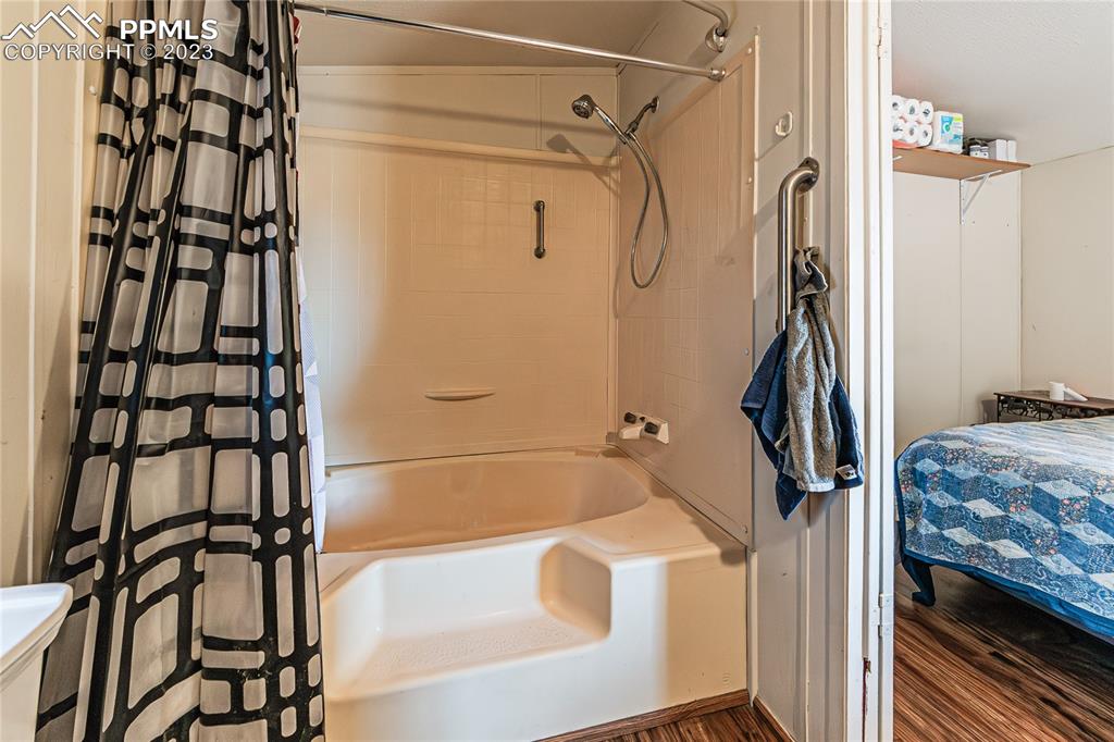 24225 East View Road Trinidad, CO 81082 - Photo 26 of 50 a bathroom with a bathtub and a shower