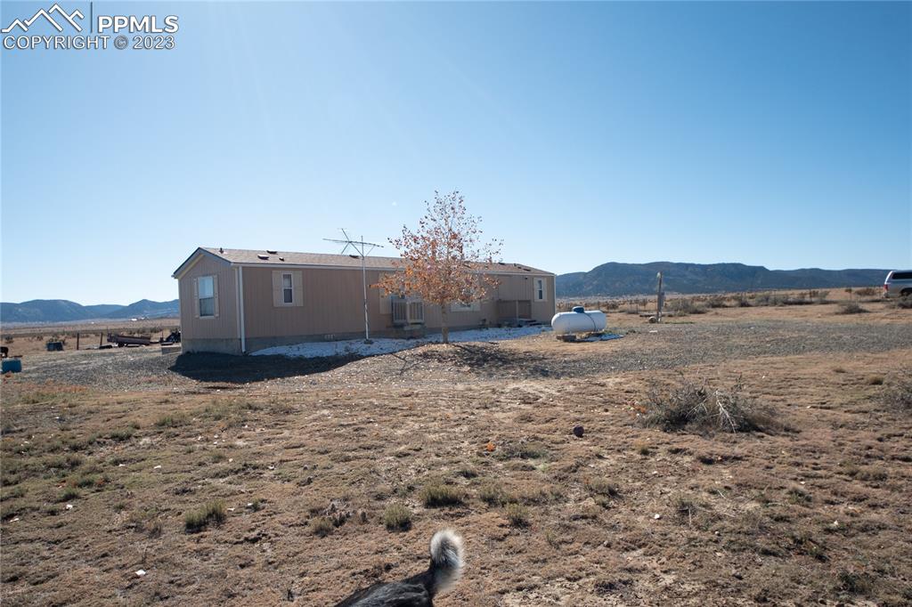 24225 East View Road Trinidad, CO 81082 - Photo 35 of 50 a view of a dry yard with a barn