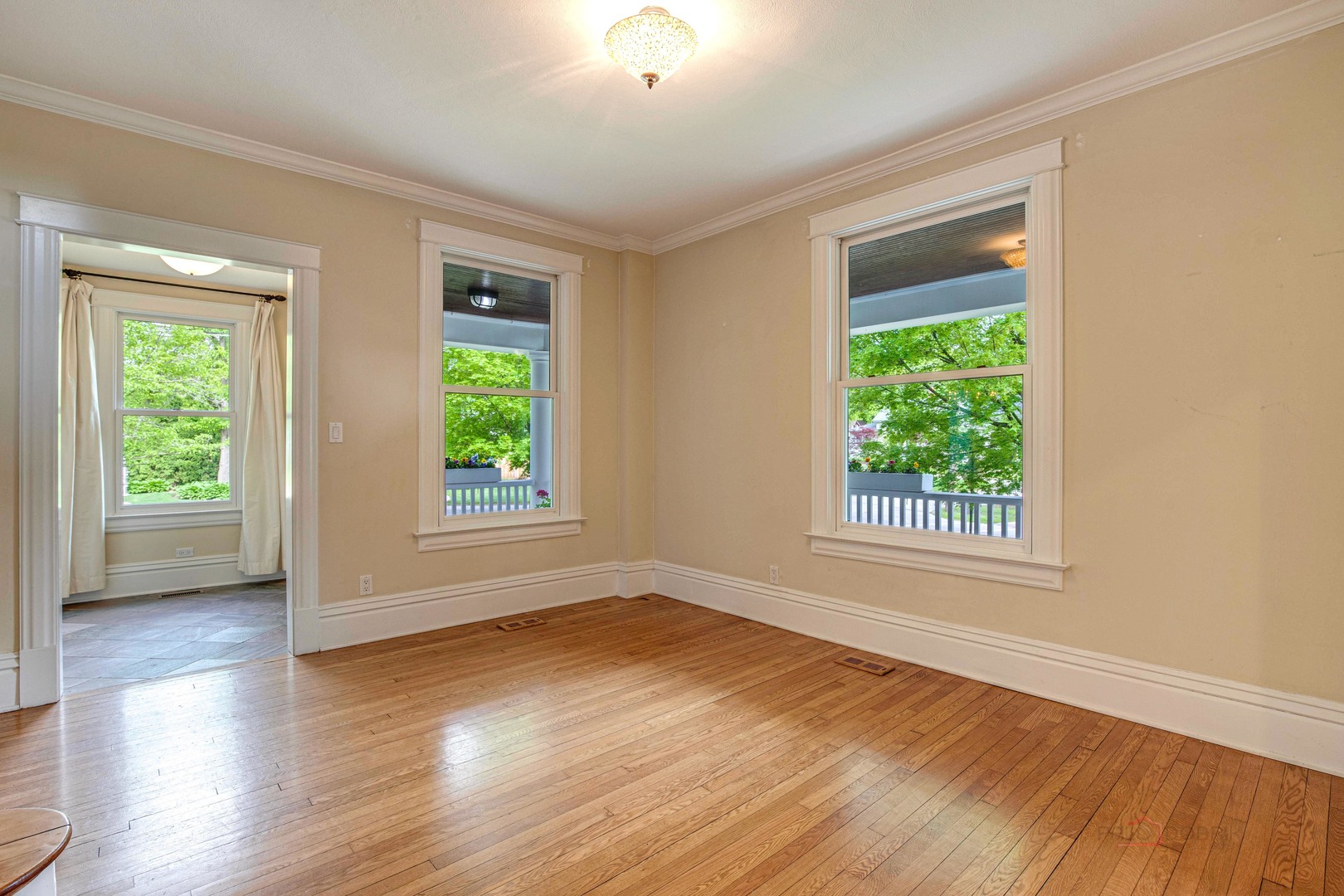 71 Washington Road Lake Forest, IL 60045 - Photo 9 of 39 a view of an empty room with wooden floor and a window