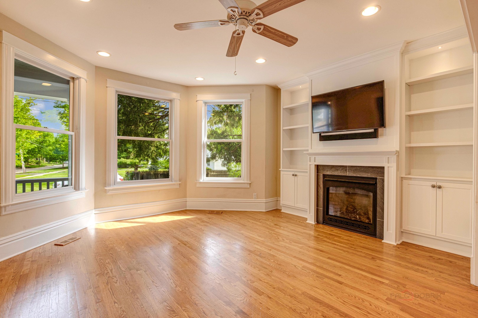71 Washington Road Lake Forest, IL 60045 - Photo 10 of 39 a view of an empty room with wooden floor fireplace and a window
