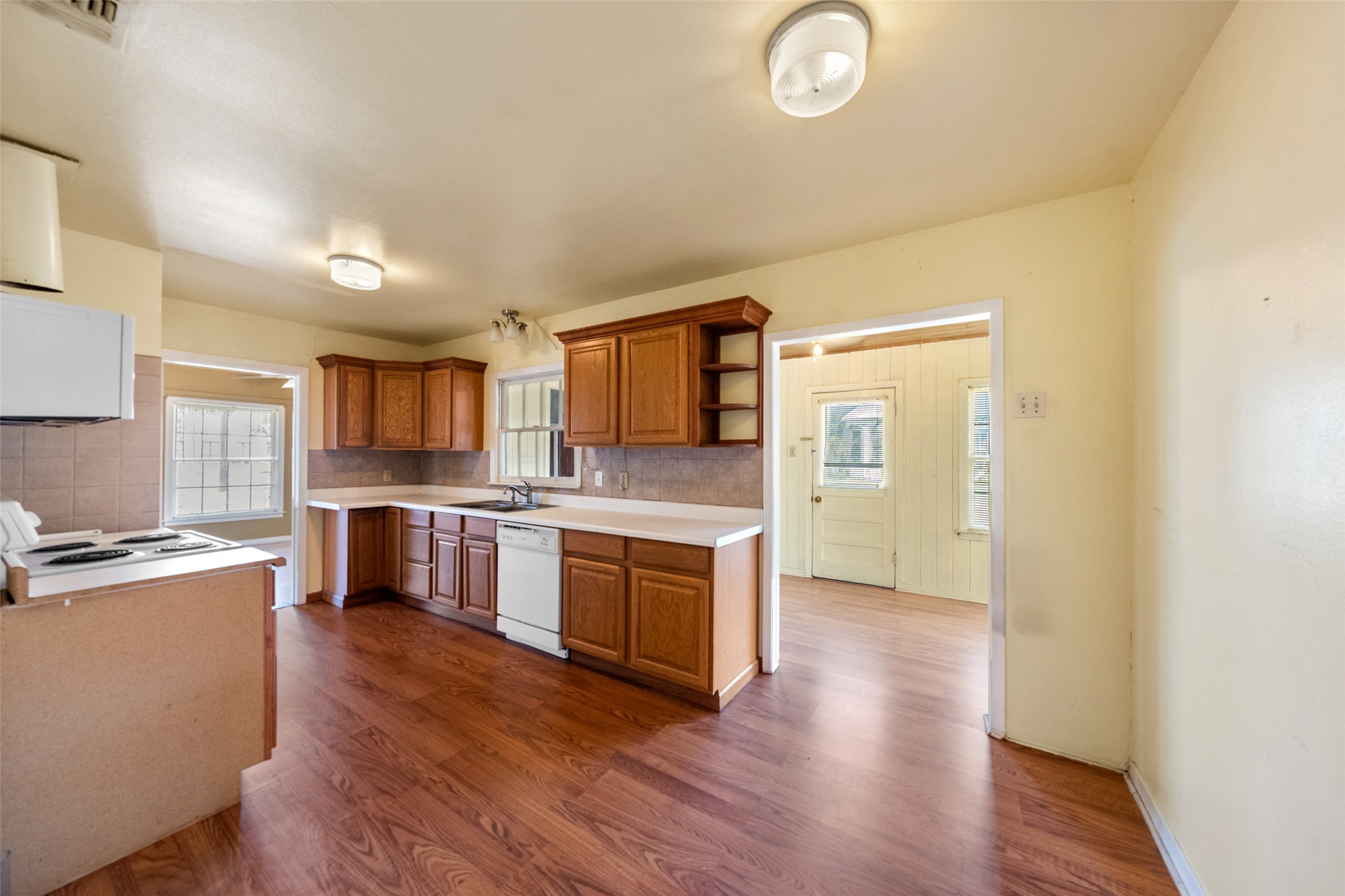 810 Main Street Hempstead, TX 77445 - Photo 15 of 32 Bright kitchen featuring abundant storage, generous workspace, and convenient access to the surrounding living and dining spaces.