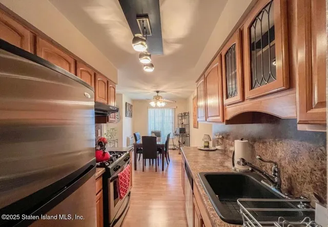 a kitchen filled with a stove and a sink