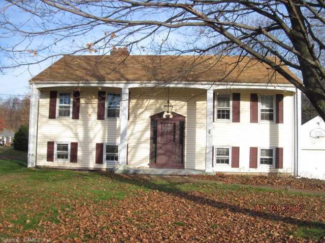 a view of a brick house with a large windows