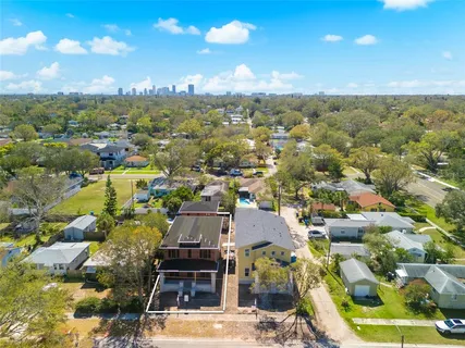 an aerial view of residential houses with outdoor space