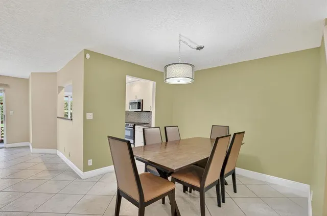 a bathroom with a sink vanity granite toilet and shower