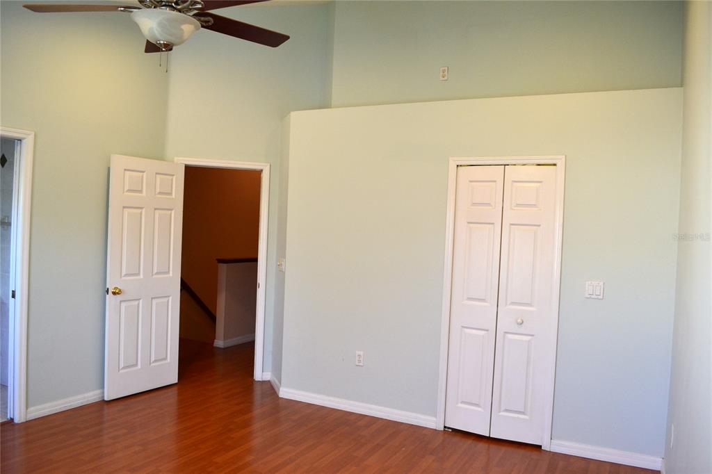 11235 Kapok Grand Circle Madeira Beach, FL 33708 - Photo 9 of 34 wooden floor in an empty room