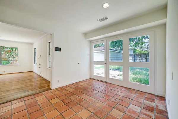 an empty room with large window